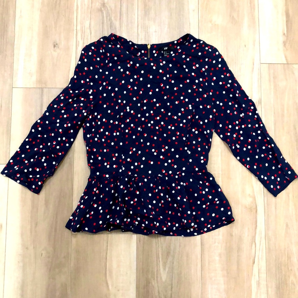 Ruffle hem polka dot top
